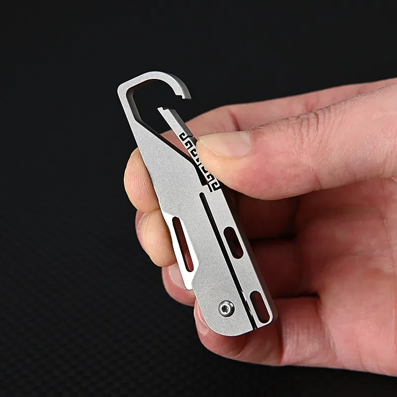 Cuchillo de bolsillo de aleación de titanio, multiherramienta de supervivencia para acampar, Mini cuchillo plegable, herramientas EDC para exteriores, llavero de cubo, cortador de Unboxing